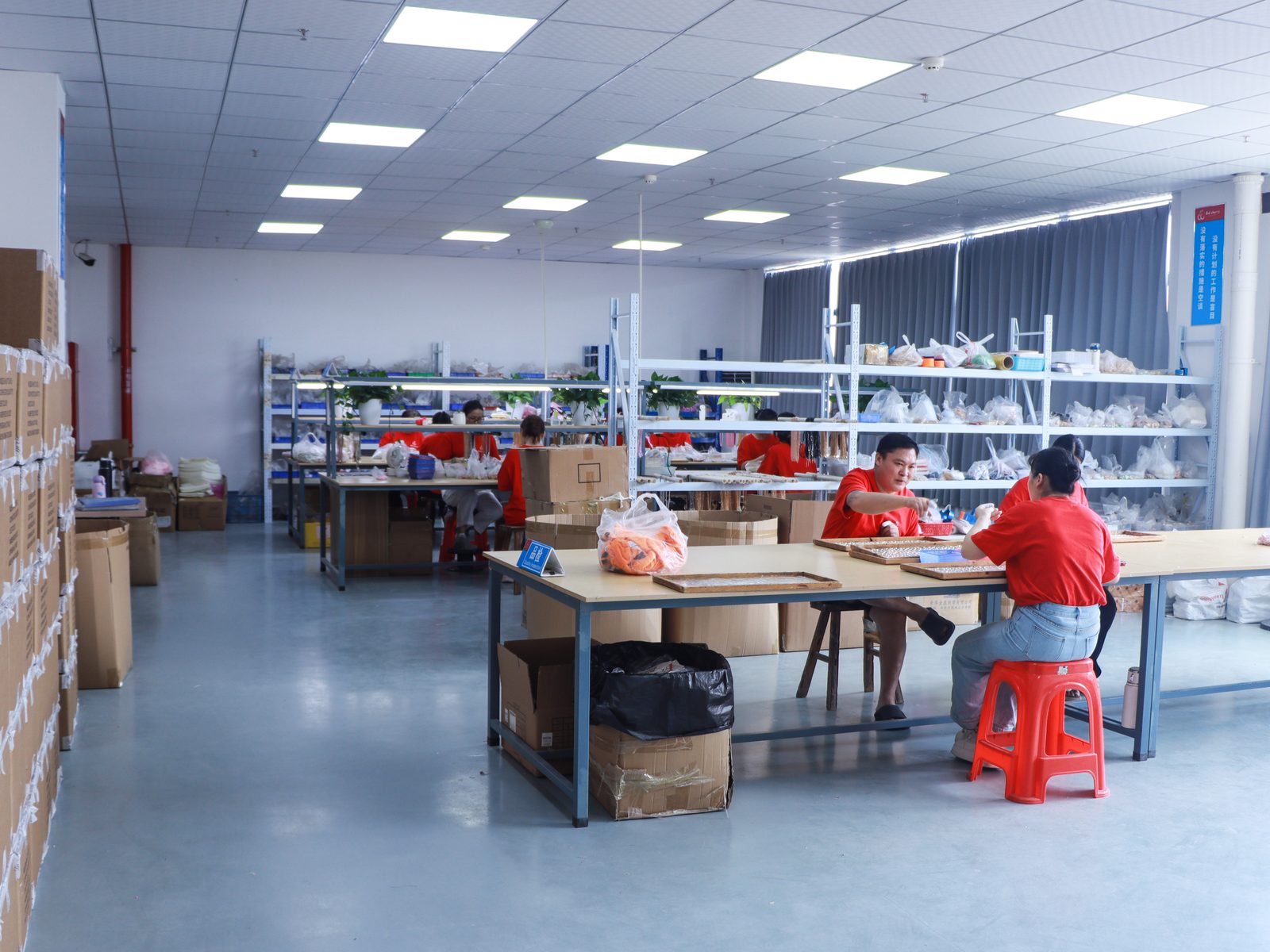 Assembly and packaging area with shelving and workstations